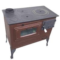 Large cast iron wood burning stove with cooking oven